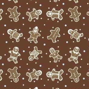 Decorated Gingerbread People with Multi Colored Sprinkles on Rich Gingerbread Brown Background