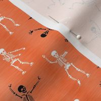 Smaller Scale Skeleton Party Funny Dancing Halloween Skeletons White and Black on Orange Texture