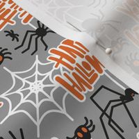 Small scale // Happy Halloween spiders // dark grey background black crawly creatures orange lettering white webs