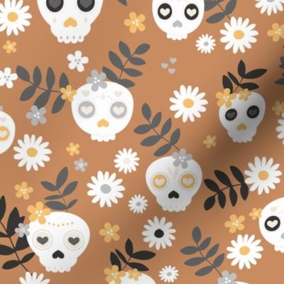 Day of the dead dia de los muertos mexican inspired skulls and bones boho halloween theme in spice caramel cinnamon orange black and white
