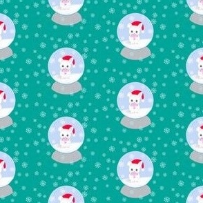 Christmas bunny snow globes on green