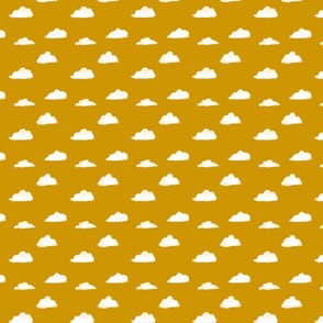 Puffy clouds on yellow