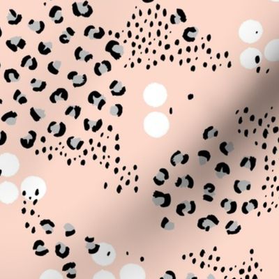 Random messy speckles spots dots and leopard print wild jungle animal in gray on coral pink