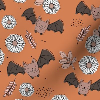 Adorable kawaii freehand bats and daisies fall lower garden boho halloween design burnt orange beige neutral pink