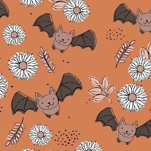 Adorable kawaii freehand bats and daisies fall lower garden boho halloween design burnt orange beige neutral pink