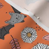 Adorable kawaii freehand bats and daisies fall lower garden boho halloween design orange pink gray