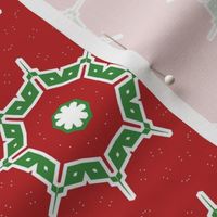 Stylized snowflake in green, red , white