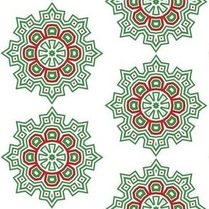 Green red snowflake style medallions on white