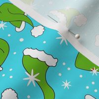 Medium Scale Green Santa Hats and Snowflakes on Blue