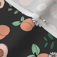 Sweet peachy fall garden leaves and peaches fruit and daisy blossom apricot green on charcoal