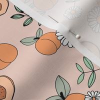 Sweet peachy fall garden leaves and peaches fruit and daisy blossom apricot orange mint green on blush