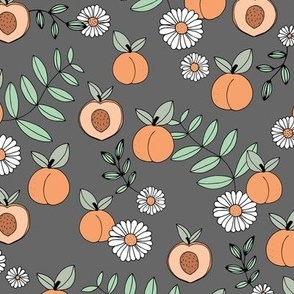 Sweet peachy fall garden leaves and peaches fruit and daisy blossom apricot green on slate gray