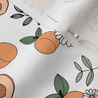 Sweet peachy fall garden leaves and peaches fruit and daisy blossom apricot orange green sage on white