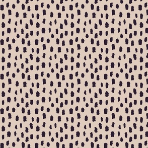 Black marks on beige background