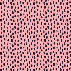 Black marks on pink background 