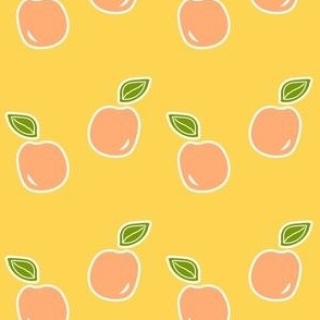 Peaches with green leaf on yellow background