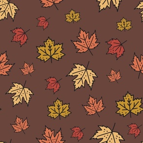 Brown autumn leaves in fall colors: burnt orange, red and 