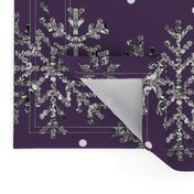 Silver snowflakes ice crystals on plum purple