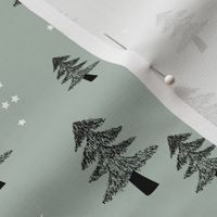 Boho Christmas forest with pine trees moon and stars winter night black on sage green