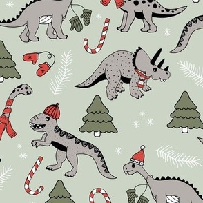 Vintage boho Christmas dinos in Santa hats seasonal garden animal design with winter twigs and gloves in slate grey on sage