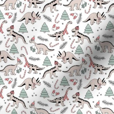 Vintage boho Christmas dinos in Santa hats seasonal garden animal design with winter twigs and gloves in faded green and red on white pastel