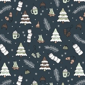 Little Christmas winter picnic with mashmellows bbq fire and hot chocolate drinks mint green gray on navy blue