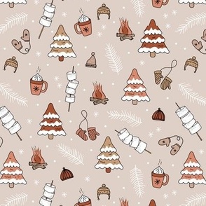 Little Christmas winter picnic with mashmellows bbq fire and hot chocolate drinks rust burnt orange beige
