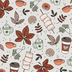Autumn picnic camping with pumpkin spice coffee and hot chocolate donuts and marshmellow  fall day in the park orange rust mint beige on mist green sand