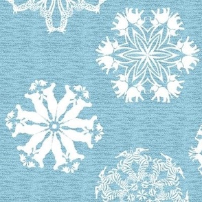 African Animal Snowflakes on Visually Textured Sky Blue