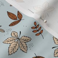 Boho fall garden oak leaves and forest branches winter petals rust cream sand on blue ice