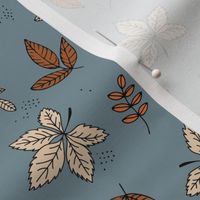 Boho fall garden oak leaves and forest branches winter petals rust cream sand on cool gray blue