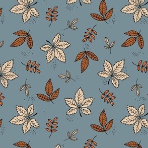 Boho fall garden oak leaves and forest branches winter petals rust cream sand on cool gray blue