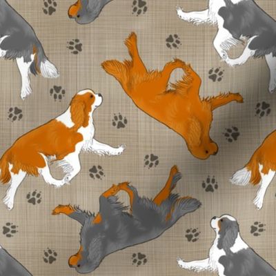 Trotting Cavalier King Charles Spaniels and paw prints - faux linen