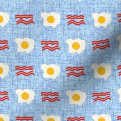 Small Scale Bacon and Eggs Breakfast Foods on Blue