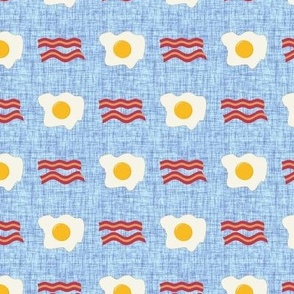 Small Scale Bacon and Eggs Breakfast Foods on Blue