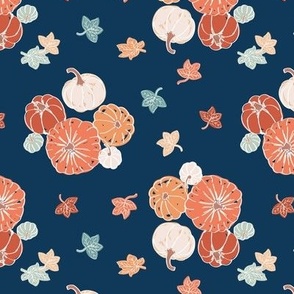 Pumpkins and leaves on navy