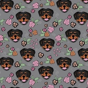 Blossom Rottweiler puppies with flowers and leaves freehand drawn dog illustration in pink mint on gray