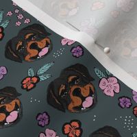 Blossom Rottweiler puppies with flowers and leaves freehand drawn dog illustration in pink blue on slate gray charcoal 