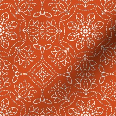 White Embroidery Look on Orange