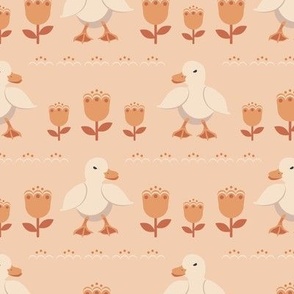Cute ducklings on a peach background