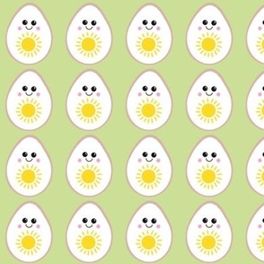 Sunny side up kawaii eggs on green