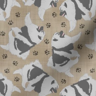 Trotting Keeshond and paw prints - faux linen