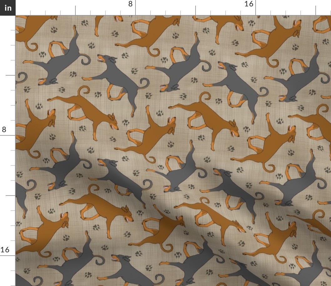 Trotting natural Doberman Pinschers and paw prints - faux linen
