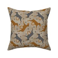 Trotting uncropped Doberman Pinschers and paw prints - faux linen