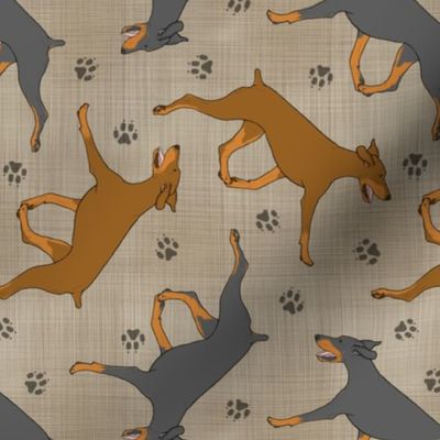 Trotting uncropped Doberman Pinschers and paw prints - faux linen