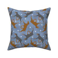 Trotting Doberman Pinschers and paw prints - faux denim