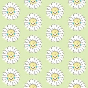 Laughing emoji daisies on green