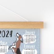 Pawsome 2024 calendar tea towel or wall hanging // pastel blue background // Greyhound Beagle black Border Collie German Shepherd Dalmatian Golden Retriever French Bulldog and Dachshund dog breeds jumping