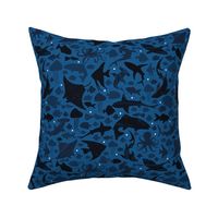 Fishes deep in the dark blue sea small