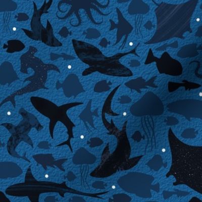 Fishes deep in the dark blue sea small